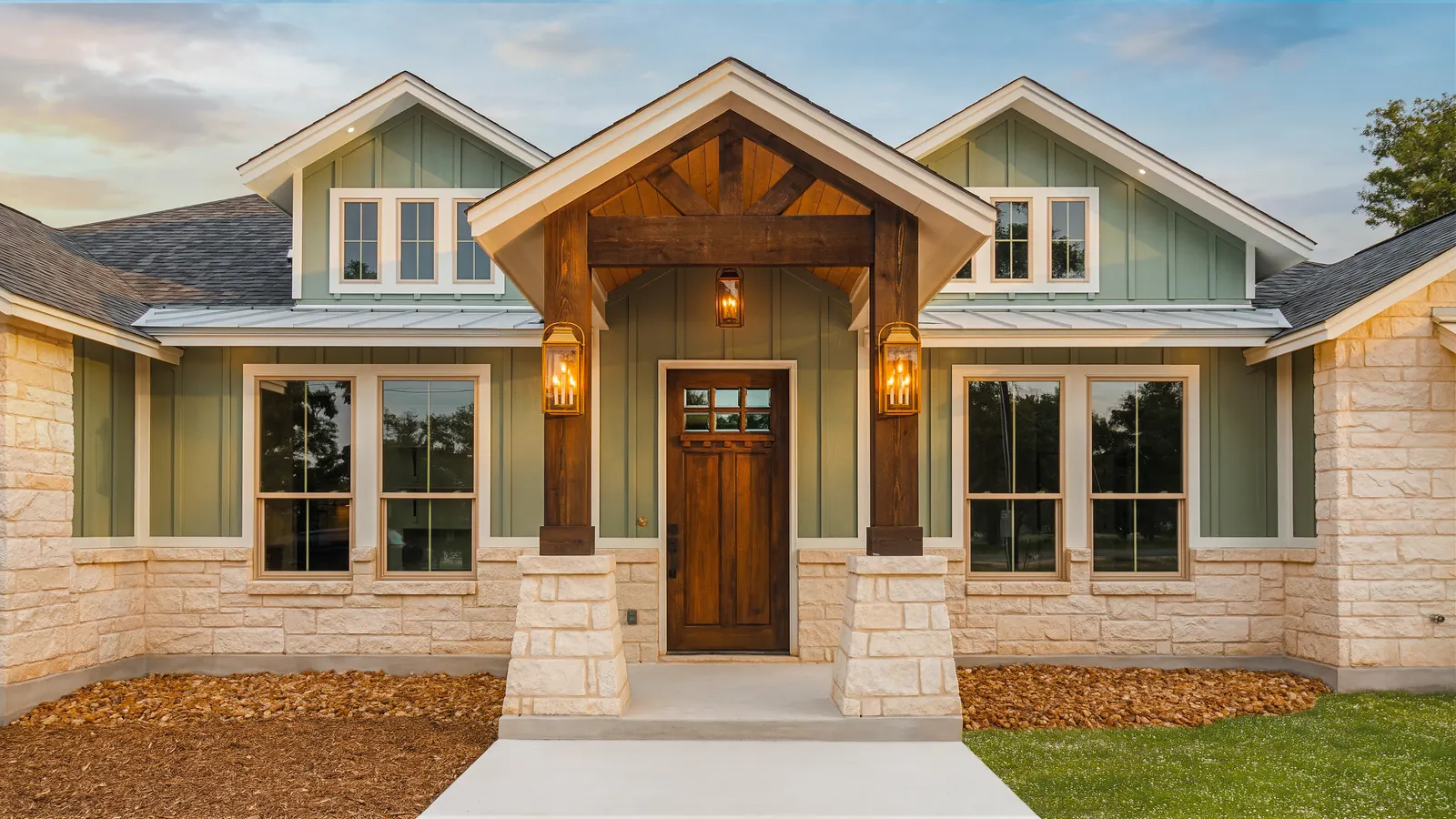 Finished custom home exterior at dusk, blended twilight exposure