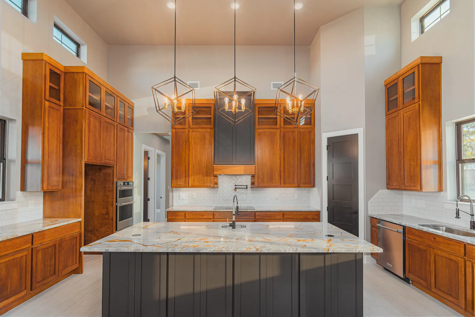 Kitchen with pendant lighting and quartzite island